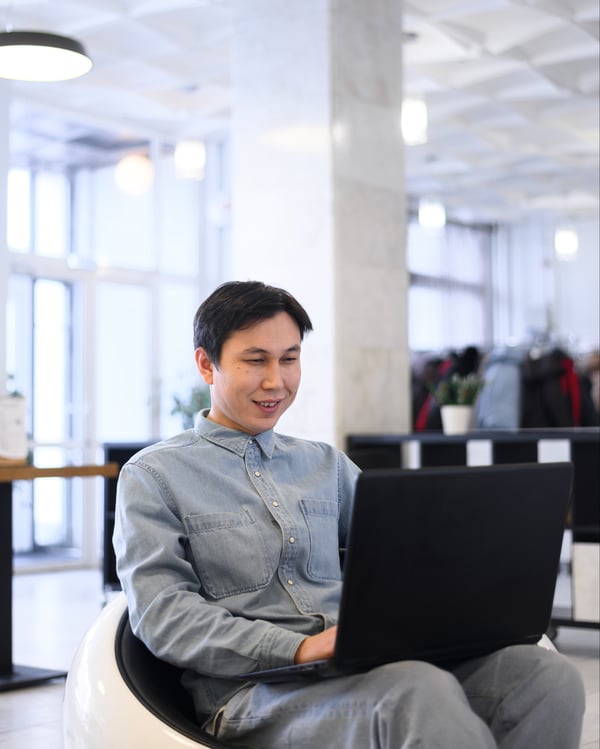 high-angle-man-working-laptop